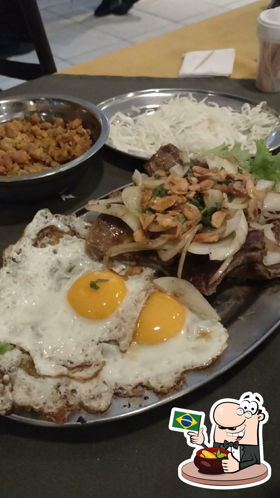 Travessa de carne com cebola, alho e ovos, em foto publicada na página do Grilos Restaurante.